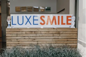 LuxeSmile sign at the Marshfield lobby entrance